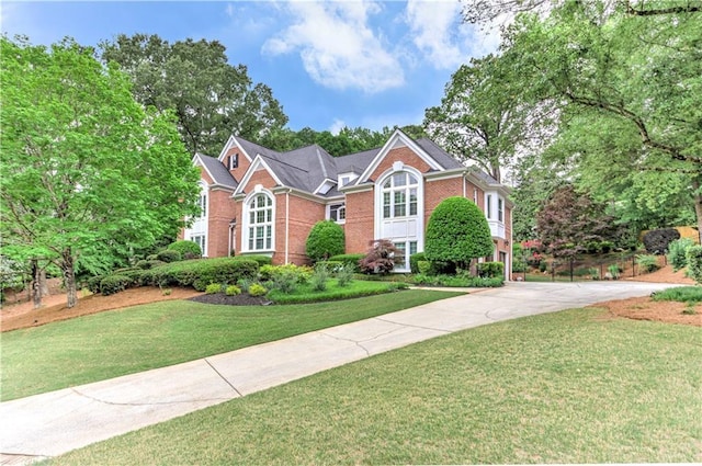 452 Brushstroke Ct SE, Marietta, GA 30067 - view of front of property with driveway, brick siding, and a front lawn