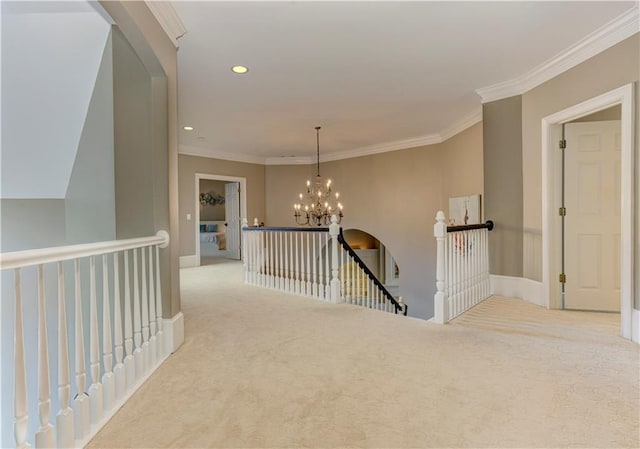 452 Brushstroke Ct SE, Marietta, GA 30067 - corridor featuring an upstairs landing, carpet floors, ornamental molding, a chandelier, and baseboards