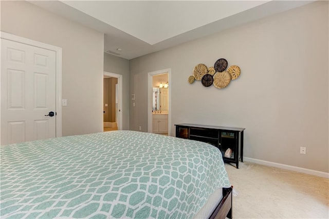 452 Brushstroke Ct SE, Marietta, GA 30067 - bedroom featuring light colored carpet, baseboards, and connected bathroom