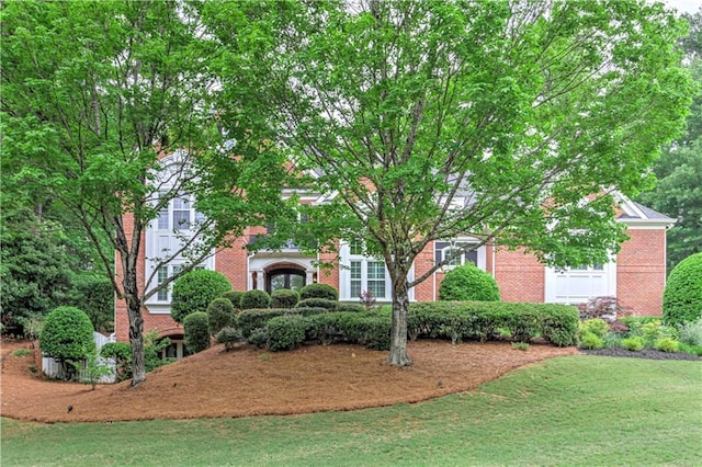 452 Brushstroke Ct SE, Marietta, GA 30067 - obstructed view of property featuring brick siding and a front lawn