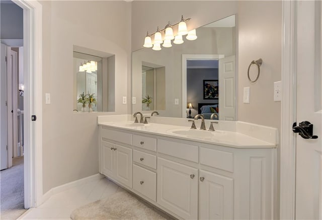 452 Brushstroke Ct SE, Marietta, GA 30067 - ensuite bathroom with double vanity, tile patterned floors, and baseboards