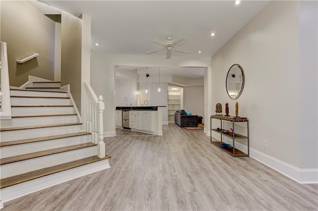 452 Brushstroke Ct SE, Marietta, GA 30067 - living room with light wood-type flooring, stairs, ceiling fan, baseboards, and recessed lighting