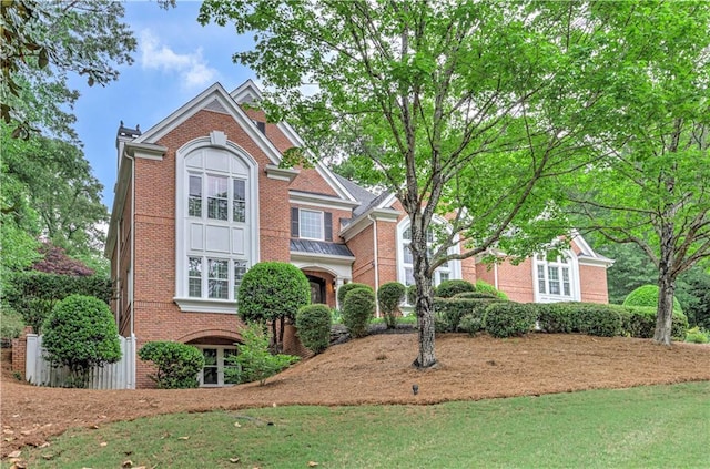 452 Brushstroke Ct SE, Marietta, GA 30067 - traditional-style house featuring brick siding and a front yard