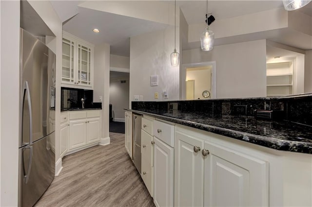 452 Brushstroke Ct SE, Marietta, GA 30067 - kitchen with freestanding refrigerator, white cabinets, light wood-type flooring, glass insert cabinets, and recessed lighting