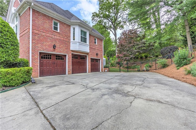 452 Brushstroke Ct SE, Marietta, GA 30067 - view of home's exterior featuring asphalt driveway, an attached garage, and brick siding
