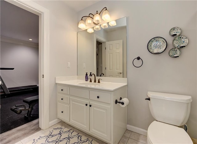 452 Brushstroke Ct SE, Marietta, GA 30067 - bathroom featuring toilet, vanity, baseboards, and ornamental molding