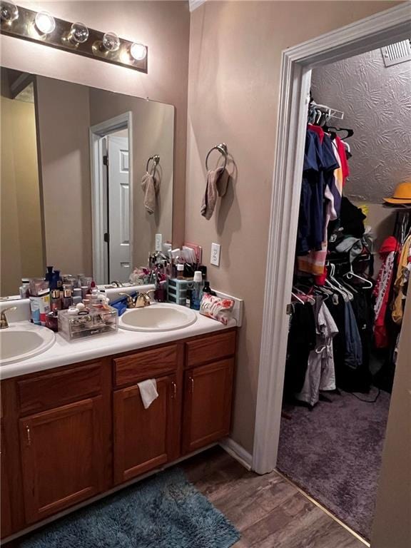 bathroom with vanity and hardwood / wood-style floors