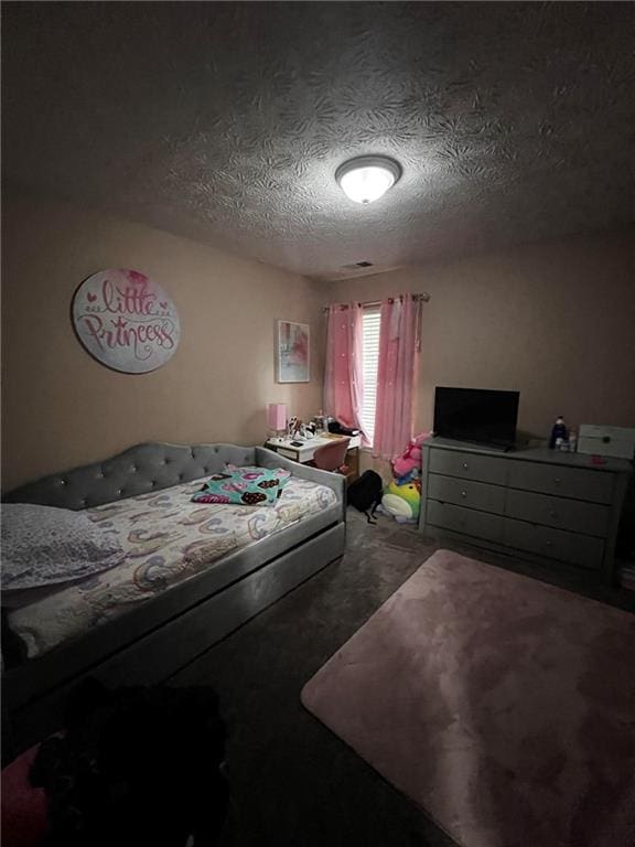 bedroom featuring a textured ceiling