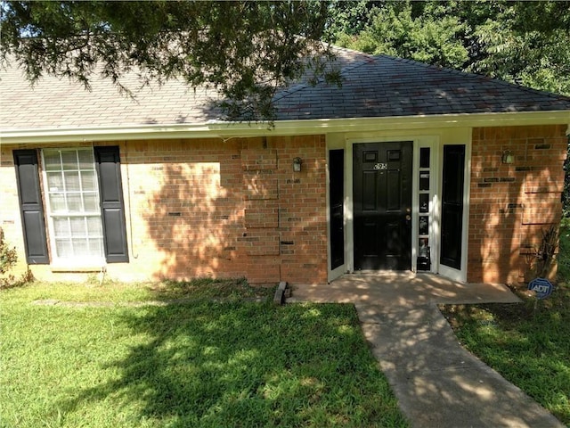 295 Forest Pl, Lawrenceville, GA 30046 - entrance to property with brick siding, a yard, and a shingled roof