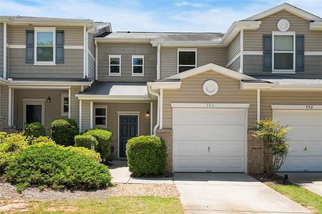 554 Rendevous Rd, Acworth, GA 30102 - townhome / multi-family property with concrete driveway and a garage