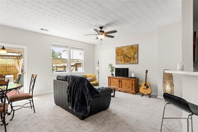 554 Rendevous Rd, Acworth, GA 30102 - living area featuring light carpet, ceiling fan, baseboards, and a textured ceiling