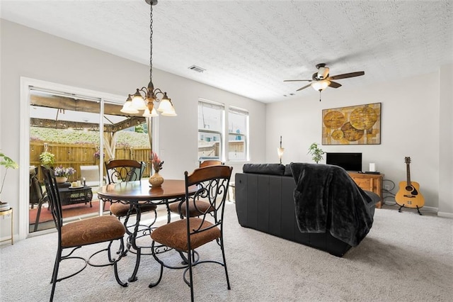 554 Rendevous Rd, Acworth, GA 30102 - carpeted dining room with a chandelier, ceiling fan, a textured ceiling, and baseboards