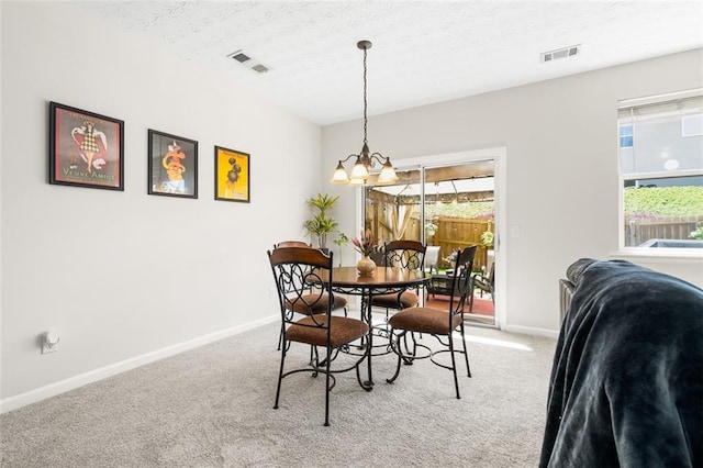 554 Rendevous Rd, Acworth, GA 30102 - carpeted dining space featuring a chandelier, baseboards, healthy amount of natural light, and a textured ceiling