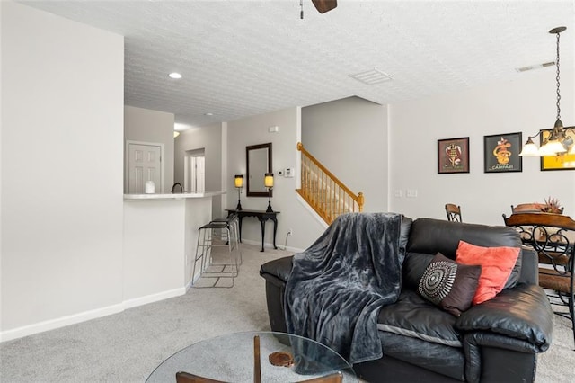 554 Rendevous Rd, Acworth, GA 30102 - living room featuring light colored carpet, baseboards, stairs, a textured ceiling, and recessed lighting