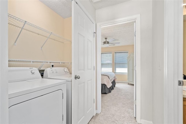 554 Rendevous Rd, Acworth, GA 30102 - laundry room with washing machine and clothes dryer, a ceiling fan, light carpet, a textured ceiling, and baseboards