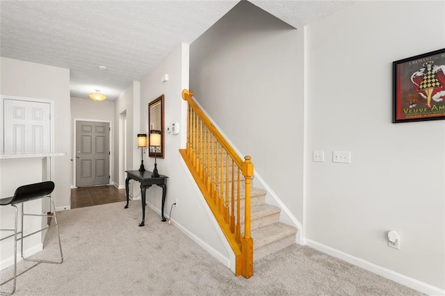 554 Rendevous Rd, Acworth, GA 30102 - staircase featuring carpet, a textured ceiling, and baseboards