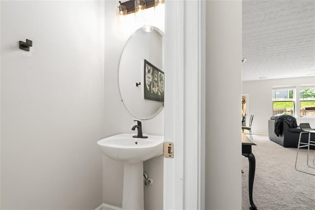 554 Rendevous Rd, Acworth, GA 30102 - bathroom featuring a textured ceiling and a sink