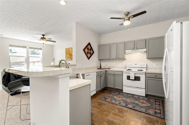 554 Rendevous Rd, Acworth, GA 30102 - kitchen featuring gray cabinetry, white appliances, a ceiling fan, under cabinet range hood, and a textured ceiling