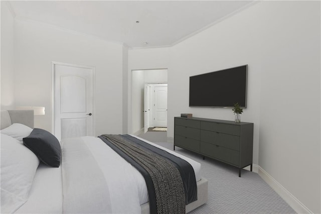 carpeted bedroom featuring crown molding and baseboards