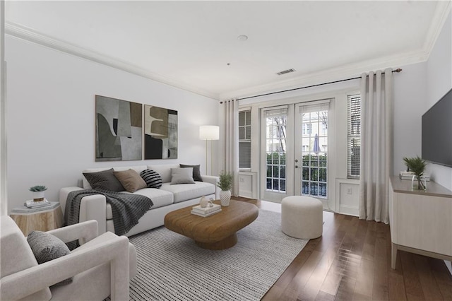 living room with ornamental molding, french doors, and hardwood / wood-style floors
