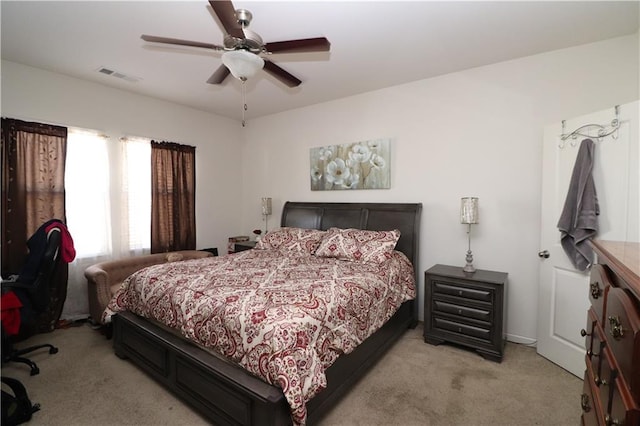 bedroom featuring ceiling fan and light colored carpet