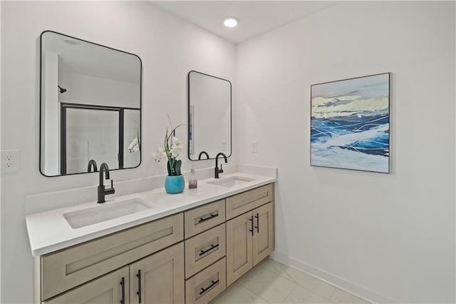 bathroom with dual vanity and tile patterned floors