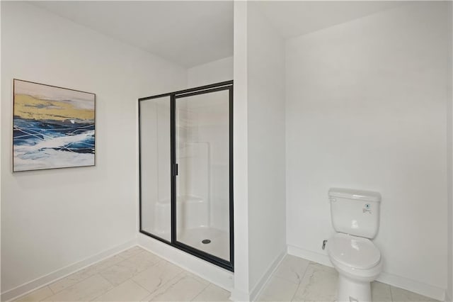 bathroom with a shower with door, toilet, and tile patterned floors