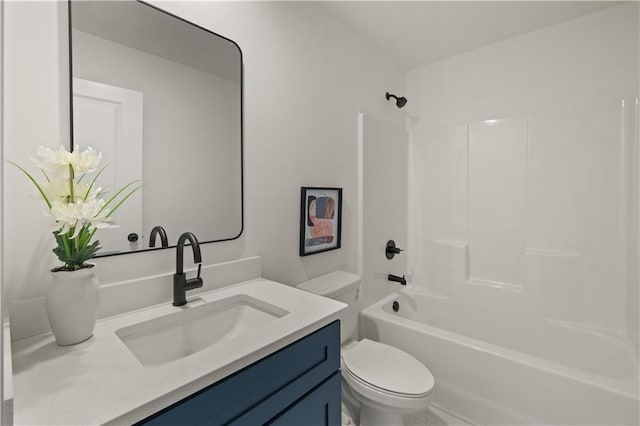 full bathroom featuring vanity, washtub / shower combination, and toilet