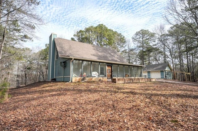 view of front facade featuring a sunroom