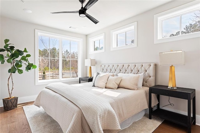 7220 Summit Pl, Alpharetta, GA 30009 - bedroom featuring multiple windows, wood finished floors, and a ceiling fan