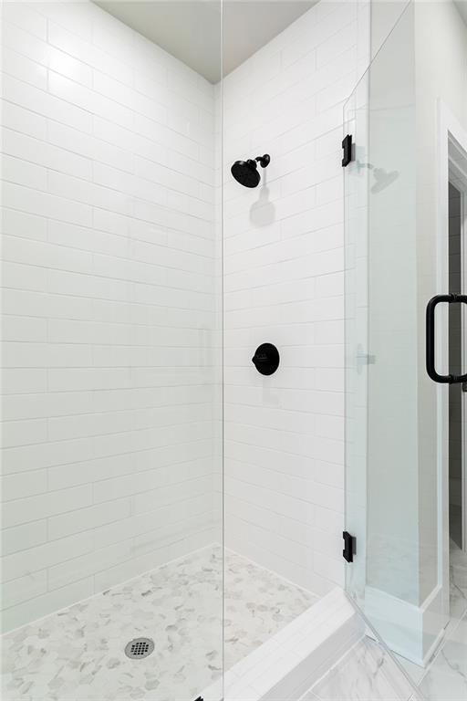 7220 Summit Pl, Alpharetta, GA 30009 - full bath featuring a shower stall and marble finish flooring