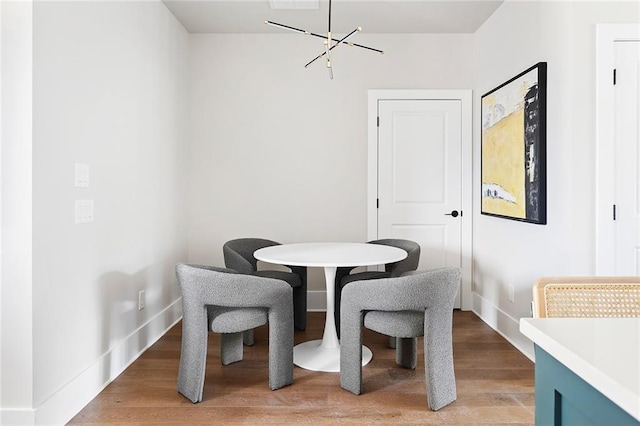 7220 Summit Pl, Alpharetta, GA 30009 - dining space with a chandelier and light wood-style flooring