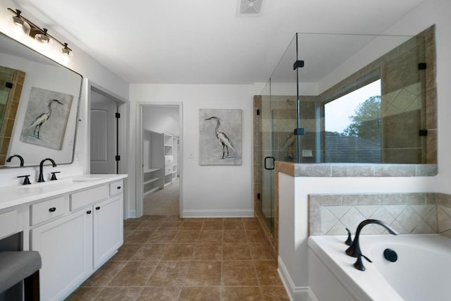 bathroom with vanity, tile patterned flooring, and shower with separate bathtub