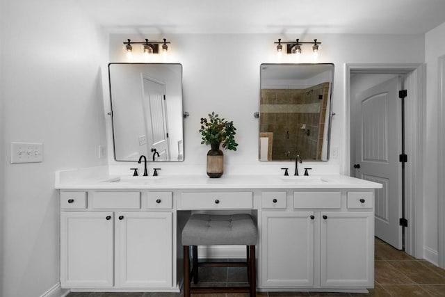 bathroom featuring tile patterned floors, vanity, and a shower with door