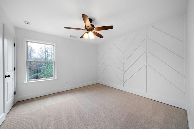 carpeted empty room with ceiling fan