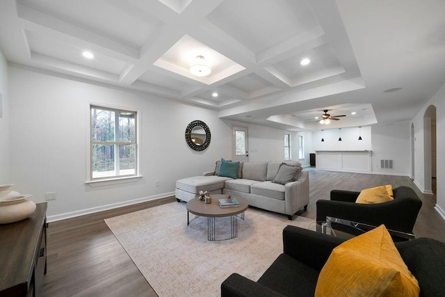 living room with hardwood / wood-style flooring, coffered ceiling, and beam ceiling