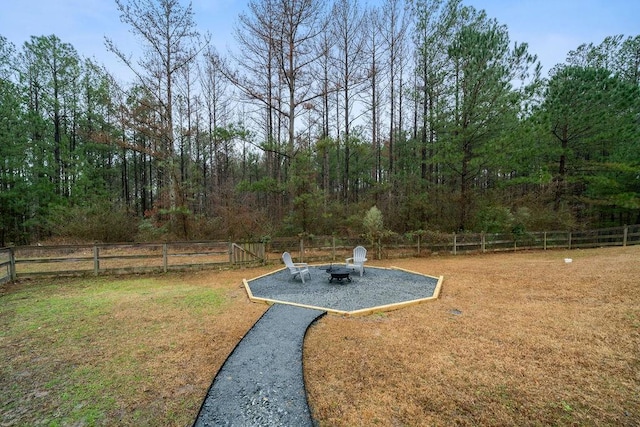 view of yard with an outdoor fire pit