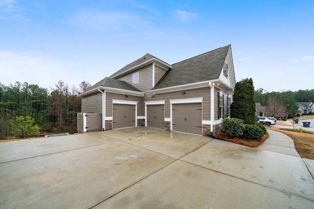 view of side of home with a garage