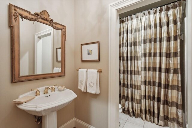 bathroom with tile patterned floors