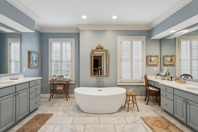 bathroom with tile patterned flooring, crown molding, a healthy amount of sunlight, and vanity