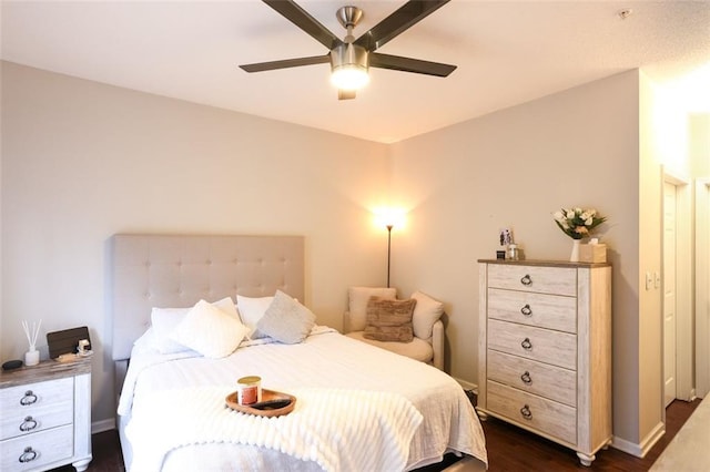 bedroom with dark wood-type flooring and ceiling fan