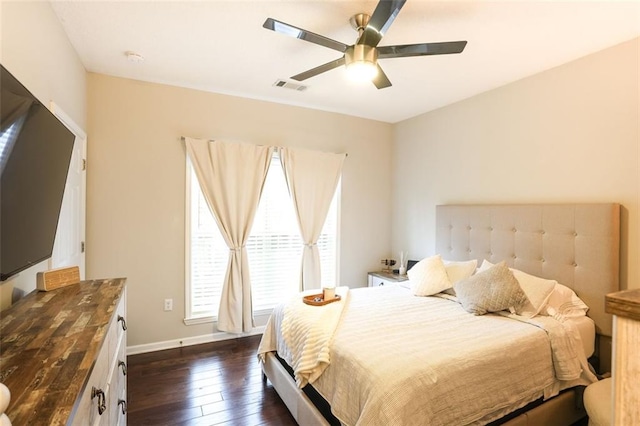 bedroom with dark wood-type flooring and ceiling fan