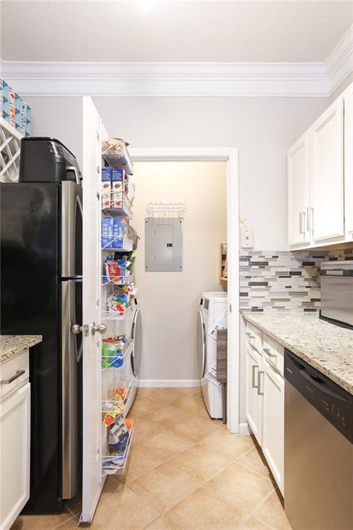 kitchen with light stone countertops, appliances with stainless steel finishes, electric panel, and independent washer and dryer