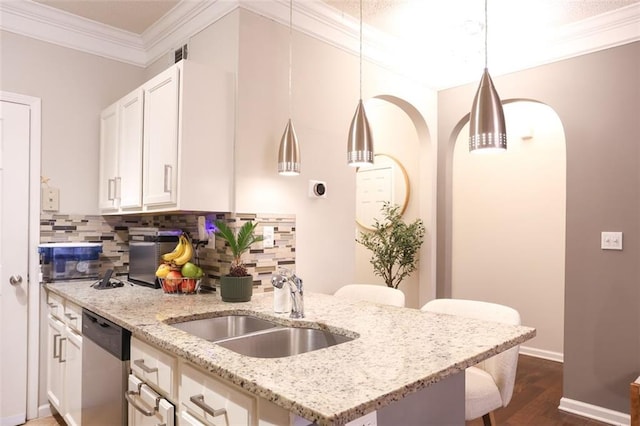 kitchen featuring sink, crown molding, light stone counters, white cabinets, and stainless steel dishwasher