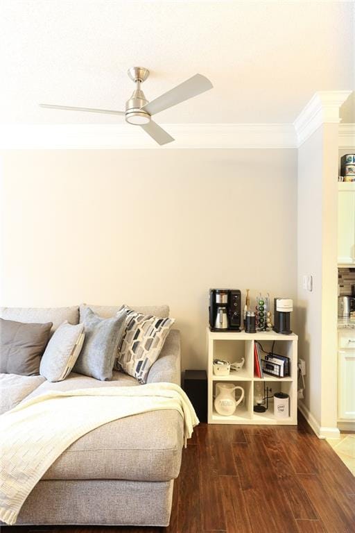 bedroom featuring ornamental molding, ceiling fan, and dark hardwood / wood-style flooring