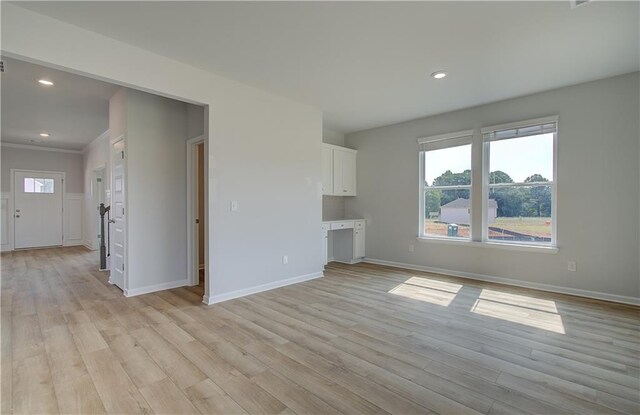 unfurnished living room featuring light hardwood / wood-style flooring