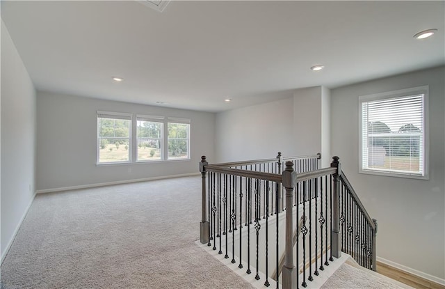 interior space featuring light carpet