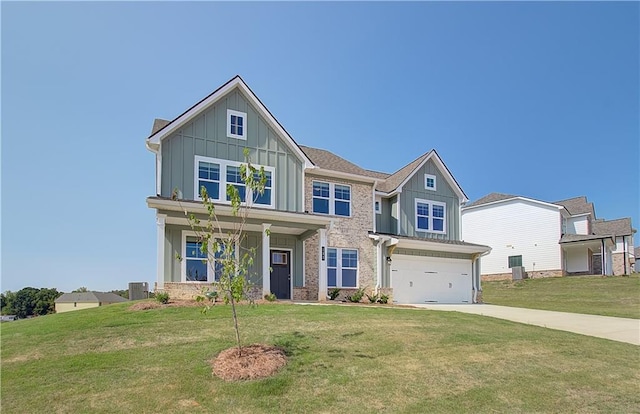 craftsman-style home featuring a garage, central air condition unit, and a front lawn