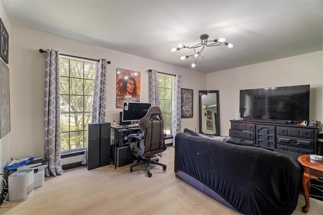 office area featuring a chandelier and wood finished floors