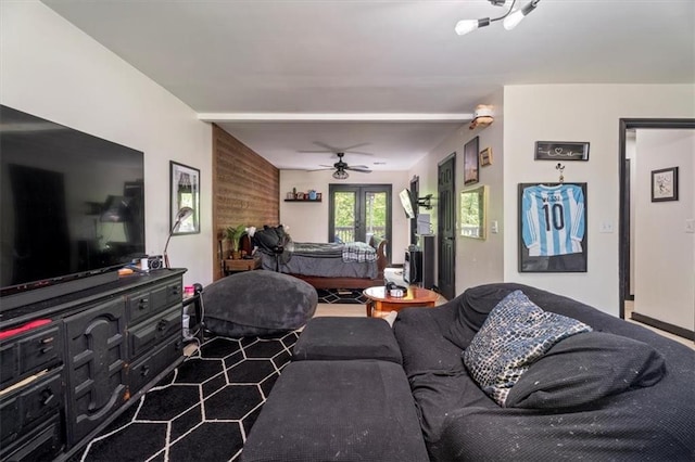 living room featuring a ceiling fan and carpet floors